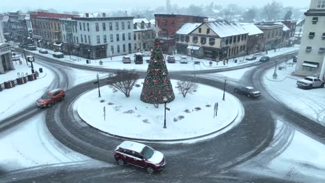American-town-center-decorated-with-Christmas-tree-during-winter-snow-storm