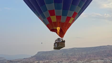 Fire-Burner-Hot-Air-Balloons-Flying-Above-Cappadocia-In-Central-Turkey