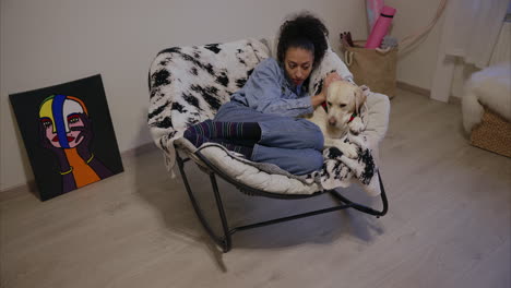 woman-loves-her-dog,-Labrador-puppy-enjoys-owner's-company,-girl-snuggles-with-her-fluffy-furry-friend,-cuddling-with-cute-purebred-dog,-pet-sitting,-animal-daycare,-therapy-dog,-human-dog-connection