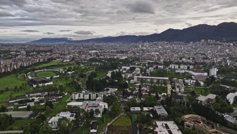 Bogota-Colombia-Aerial-v41-flyover-university-campus-capturing-cityscape-of-La-Soledad,-Teusaquillo-and-downtown-with-Monserrate-mountain-landscape-backdrop---Shot-with-Mavic-3-Cine---November-2022