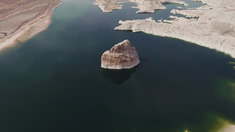 A-high-flying-drone-shot-over-Lake-Mead,-a-massive-reservoir-formed-by-the-Hoover-Dam-on-the-Colorado-River,-that-lies-on-the-border-of-Arizona-and-Nevada,-just-east-of-Las-Vegas