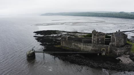 Drone-shot-of-Blackness-Castle-surrounded-by-Scotland's-waters