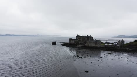 Aerial-shot-pushing-towards-the-infamous-Blackness-Castle-in-Scotland