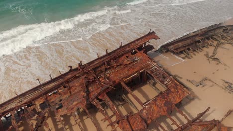 Beautiful-reveal-of-rusty-wreck-and-magnificent-beach-on-Fraser-Island