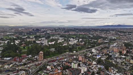 Bogota-Colombia-Aerial-v40-drone-flyover-La-Soledad-capturing-busy-traffics,-educational-institutions-campus-in-Teusaquillo-and-Quinta-Paredes-cityscape-views---Shot-with-Mavic-3-Cine---November-2022