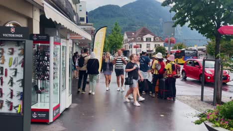 Crowds-of-Tourist-Near-Urban-City-Center-|-Interlaken-Switzerland-Immersive-Travel-Tourism-Mountainside-Valley-Resort-City,-Europe,-Walking,-Rainy-Day,-4K