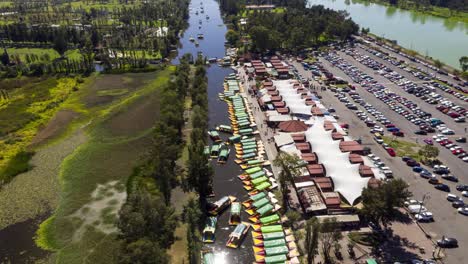 Aerial-hyper-lapse-of-Xochimilco-lake-with-chinampas-and-trajineras-floating-through-the-channels