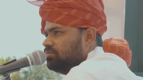 Indian-Guy-with-turban-in-front-of-a-Microphone