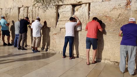 People-praying-at-the-Western-Wall-in-Jerusalem,-Israel