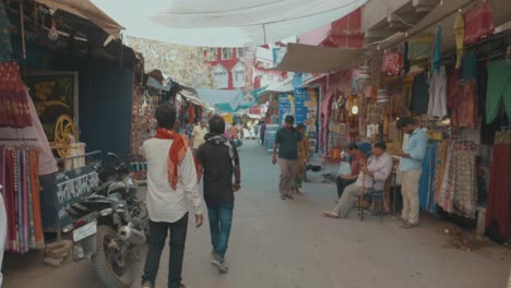 Walking-Through-An-Indian-Market-Place-With-Colorful-Stores-Filled-With-Items-To-Buy-Busy-With-Local-People