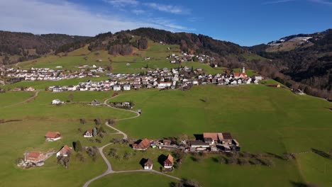 Aerial-view-of-quaint-rural-village-in-Swiss-countryside