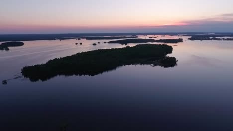 Aerial-of-a-lake-and-forest-at-dawn-in-Finland