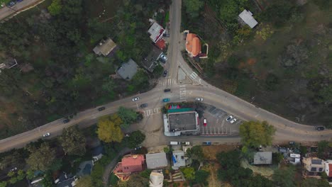 Aerial-Drone-Shot-of-Rustic-Winding-Intersection-in-Laurel-Canyon,-Los-Angeles,-Curved-Roads-with-Cars-Driving