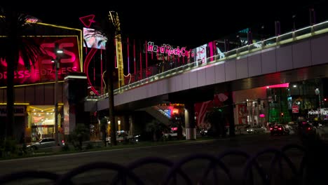Night-View-Of-Pedestrian-Bridge-And-Hard-Rock-Cafe-Along-Las-Vegas-Strip-In-Nevada