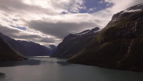 Aerial-of-a-lake-surrouded-by-mountains-in-Norway
