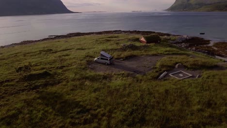 Aerial-of-a-camping-car-near-a-fjord-on-Lofoten,-Norway
