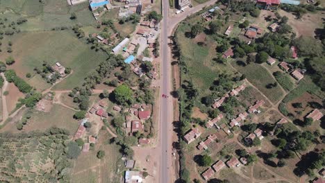 Modern-highway-in-Loitokitok-village,-Southern-Kenya,-aerial-view