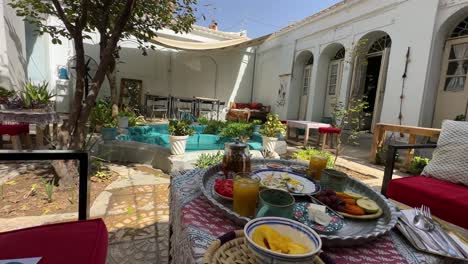 Serve-breakfast-in-old-traditional-design-house-in-Esfahan-city-urban-life-historical-architecture-ancient-plan-calm-relax-stay-the-accommodation-concept-in-Iran-hospitality-wooden-door-backyard