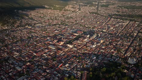DRONE-SHOT:-ORBIT-FROM-HIGH-ALTITUDE-TO-LOW-ALTITUDE-AT-URUAPAN-MICHOACAN-PLAZA