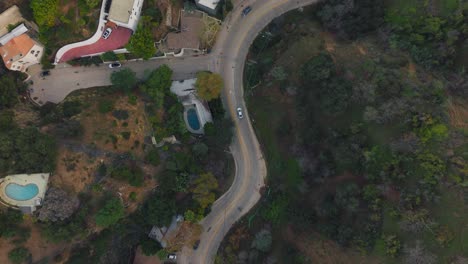 Drone-Flying-Over-Curvy-Los-Angeles-Mountain-Road-in-Daytime,-Laurel-Canyon-at-Daytime
