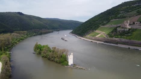 Riverboats-cruising-historic-landmarks-on-river-Rhine-in-Bingen-Germany,-Aerial