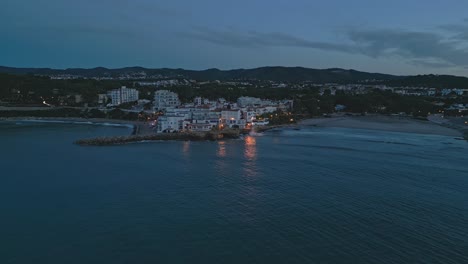 Aerial-view-of-Roc-de-Sant-Gaieta-and-its-stone-pier-at-dawn