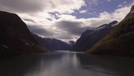 Aerial-of-a-lake-surrouded-by-mountains-in-Norway