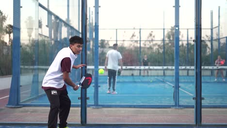 Murcia,-Spain,-February-2,-2024:-Young-sportsmen-playing-padel-tennis-in-slow-motion