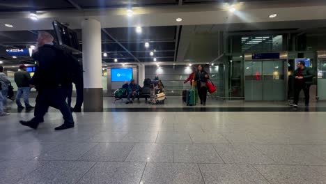 Panorama-wide-angle-of-walking-passenger-after-landing-at-airport-in-arrival-hall