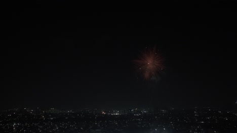 Aerial-view-of-colorful-fireworks-exploding-at-night-sky-in-Chennai,-India