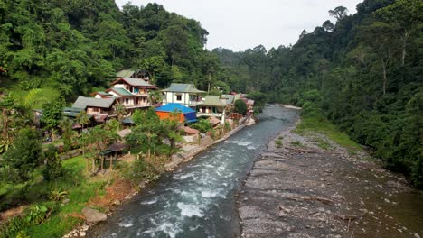An-aerial-drone-view-of-the-Bukit-Lawang-river-in-Bukit-Lawang,-Sumatra