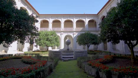 A-cloister-garden-inside-a-Portuguese-monastery,-called-'Santa-Mafalda-de-Arouca-Monastery,'-featuring-a-stone-monument-,-situated-in-Arouca