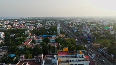 Parallax-drone-shot-of-city-of-Chennai-with-busy-roads-during-afternoon-in-India