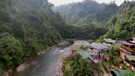 An-aerial-drone-view-of-the-Bukit-Lawang-river-in-Bukit-Lawang,-Sumatra