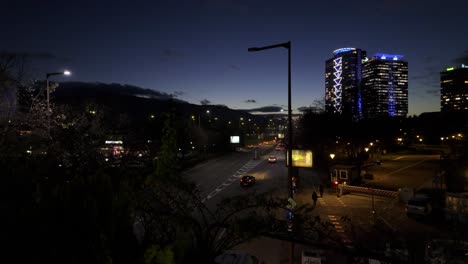 car-traffic-at-'Bulgaria-Boulevard'-at-night,-high-rise-buildings-on-the-right