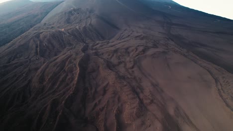 Drone-flying-over-a-volcano-crater-at-Mount-Etna,-Sicily