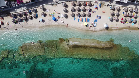 the-beach-at-Agia-Pelagia-in-Crete-sports-an-array-of-umbrellas