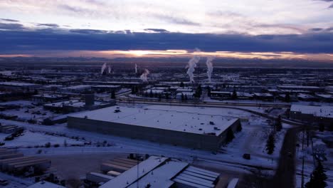 Aerial-Shot-of-Winter-Factory-Steaming-Pipes