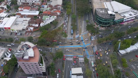 Aerial-Orbit-View-of-Busy-Intersection-at-Rush-Hour