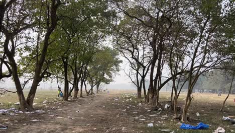 Cinematic-shot-of-an-empty-pathway-of-a-forest-with-blurred-background-in-Kolkata,-India-during-daytime