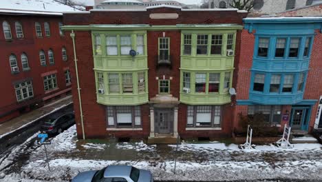 Colorful-rowhouses-in-snowy-city-in-USA