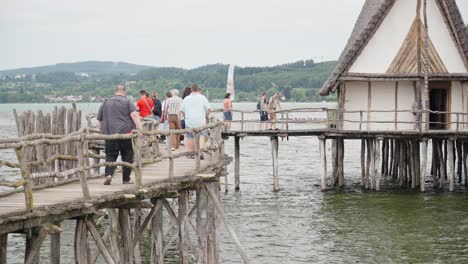 Visitors-Tour-Site-of-Pile-Dwelling-Open-Air-Museum-on-Lake-Constance-in-Friedrichshafen,-Germany
