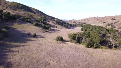 4K-Aerial-Footage-of-Dessert-in-Santa-Monica-Mountains-in-Los-Angeles,-California-on-a-warm-sunny-day