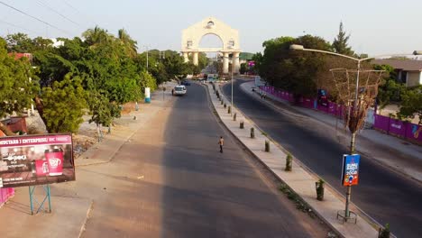 Aerial-Drone-Landmark-of-The-Gambia-Banjul-City,-Arch-22-Road-Town-Park-Panorama