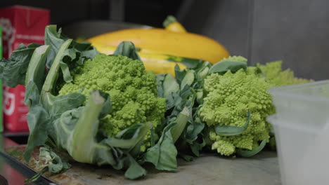 Closeup-profile-view-of-a-broccoli-kept-on-a-table-in-a-kitchen-of-a-French-typical-restaurant