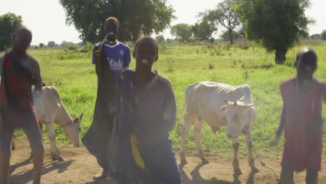 Young-Mundari-boys-dancing-their-traditional-dance-in-the-cattle-camp-in-Terekeka-county,-Juba,-south-sudan