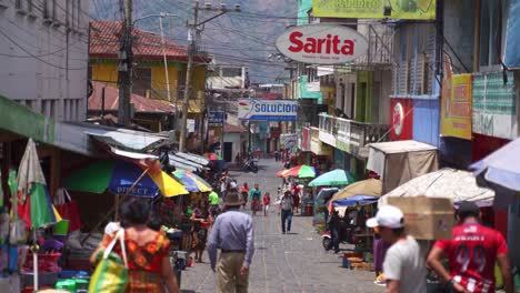 Busy,-colourful,-crowded-street-in-San-Juan,-Lake-Atitlan,-Guatemala