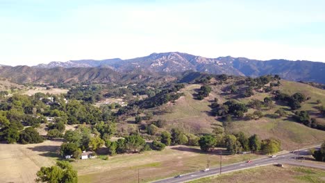 4K-Drone-shot-of-Santa-Monica-Mountains-near-Malibu-Creek-State-Park-on-a-sunny-clear-day