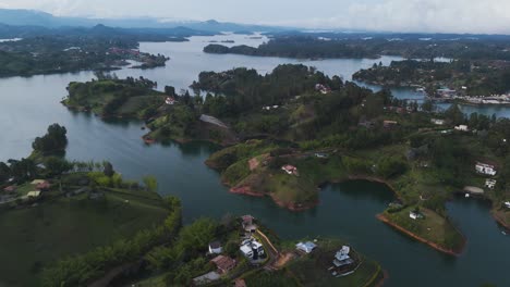 Beautiful-Colombian-Landscape-of-Guatape-Town-Rivers,-Aerial