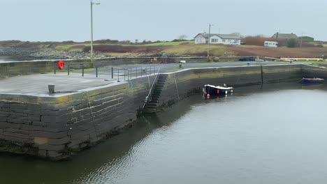 Establishing-pan-across-Tarrea-Pier-Galway-with-empty-boat-ramp